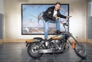 ING Direct president Arkadi Kuhlmann atop motorcycle